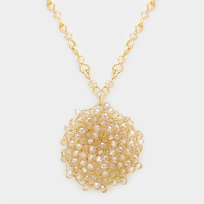 Glass bead pinwheel pendant necklace