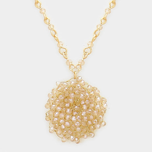 Glass bead pinwheel pendant necklace